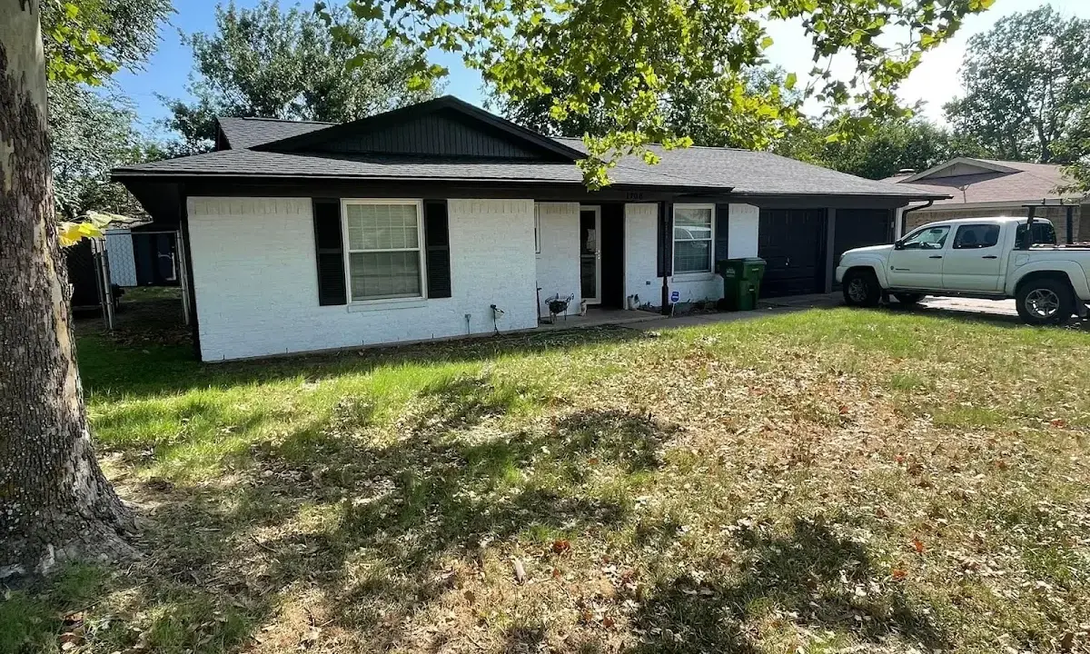 Professional roofing crew working on a residential roof in Munster